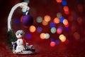 New Year card. Christmas picture with a Christmas tree and a snowman. Bokeh background Royalty Free Stock Photo