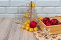 New Year card. Christmas tree and snowflakes carved from wood, a bag with gifts, New Year`s balls. Place for an