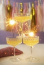 New Year Card Design with three glass of champagne and sparkler Royalty Free Stock Photo
