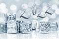 2022, new year card. Small Christmas gifts in shiny silver paper bokeh lights background Royalty Free Stock Photo