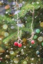 New Year card. Strawberries hanging on a spruce branch. Royalty Free Stock Photo