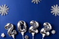 New year ccard flat lay with silver number balloon Royalty Free Stock Photo