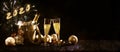 New year celebration banner with text 2020 champagne bottle and glasses, golden christmas decorations and fireworks against a dark Royalty Free Stock Photo