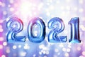 2021 New Year celebration. Creative design with blue balloons and blurred lights on color background Royalty Free Stock Photo