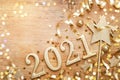 New Year celebration and festive background with golden numbers 2021, confetti stars and Christmas decorations top view Royalty Free Stock Photo