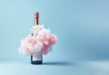 New Year celebration surreal background. Champagne bottle with pink cotton clouds. Royalty Free Stock Photo