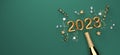 New Year 2023 celebration theme with a champagne bottle with confetti - 3D Royalty Free Stock Photo