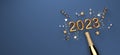 New Year 2023 celebration theme with a champagne bottle with confetti - 3D Royalty Free Stock Photo