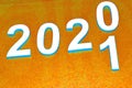 New year 2020 change of concept for 2021, change of white numbers on an orange background Royalty Free Stock Photo