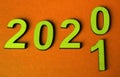 New year 2020 change of concept for 2021, change of yellow numbers on an orange background Royalty Free Stock Photo