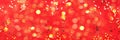New year, Christmas background. Golden shiny glitter, sparkles, light bokeh on red background. Banner with copy space Royalty Free Stock Photo