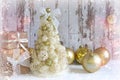 New Year, Christmas background, rustic style. Festive Christmas tree in gold on white wood background and craft boxes tied with sa Royalty Free Stock Photo