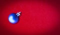 New Year and Christmas, Blue Ball on a Red Shining Background, Greeting Card Royalty Free Stock Photo
