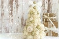 New year, Christmas card.New Year, Christmas background, rustic style. Festive Christmas tree in gold on white wood background and