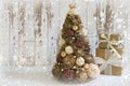 New year, Christmas card.New Year, Christmas background, rustic style. Festive Christmas tree in gold on white wood background and