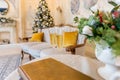 New Year and Christmas Celebration. Two Champagne Glasses over Golden Blinking christmas tree, Holiday Background Royalty Free Stock Photo