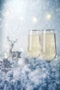 New Year and Christmas Celebration .Two Champagne Glasses and Holiday decoration. Beautiful shiny place setting for Christmas. Royalty Free Stock Photo