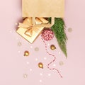 New Year Christmas composition. Paper bag and holiday decorations golden gift Christmas balls fir branches confetti Candy Cane on Royalty Free Stock Photo