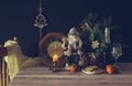 The Santa Claus, clock, tangerines, christmas cookies and champagne Royalty Free Stock Photo