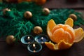 New Year and Christmas concept. fir branches, candles and mandarin. winter mood. selective focus