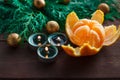 New Year and Christmas concept. fir branches, candles and mandarin. winter mood. selective focus
