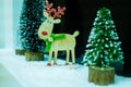 A new year or christmas congratulatory postcard with deer Christmas trees.