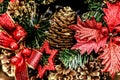 New Year and Christmas decor background of cones, winter berries, spruce branches, toys and burning candles Royalty Free Stock Photo