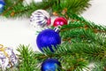 New Year and Christmas decoration with green fir tree branches and blue and silver shiny xmas traditional balls and baubles Royalty Free Stock Photo