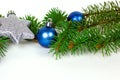 New Year and Christmas decoration with green fir tree branches and blue and silver shiny Xmas traditional balls and baubles Royalty Free Stock Photo