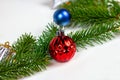 New year and christmas decoration with green fir tree branches and blue and silver shiny xmas traditional balls and baubles Royalty Free Stock Photo