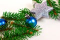 New Year and Christmas decoration with green fir tree branches and blue and silver shiny xmas traditional balls and baubles Royalty Free Stock Photo