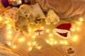 New year or christmas decoration in home interior. At night, the room glows with festive lights. A lots of gifts and decorations. Royalty Free Stock Photo