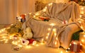 New year or christmas decoration in home interior. At night, the room glows with festive lights. A lots of gifts and decorations. Royalty Free Stock Photo