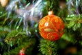 New Year and Christmas decorations, ball hangs on xmas tree close-up Royalty Free Stock Photo