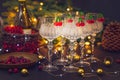 New Year and Christmas decorations with wineglasses, Christmas tree and clock