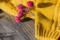 New Year and Christmas decorations and decorations with a yellow sweater on a wooden surface background Royalty Free Stock Photo