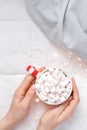 New Year or Christmas flat lay top view with Hot cacao coffee chocolate with marshmallows mug in woman hands Xmas holiday Royalty Free Stock Photo