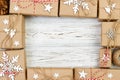 New Year and Christmas Frame Composition. handmade wrapped christmas gift boxes with decoration on white background with empty cop Royalty Free Stock Photo