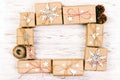 New Year and Christmas Frame Composition. handmade wrapped christmas gift boxes with decoration on white background with empty Royalty Free Stock Photo