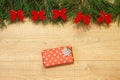 New Year / Christmas gifts in package, tree with red bows on the wooden background template Royalty Free Stock Photo