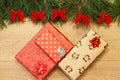 New Year / Christmas gifts in package, tree with red bows on the wooden background template Royalty Free Stock Photo