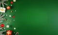 New Year and Christmas green background with decoration on side mockup. Flat lay. Top view. Christmas tree, toys, gift boxes Royalty Free Stock Photo