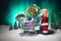 New year or Christmas holiday shopping concept. Store promotions. Santa Claus carrying trolley cart on snow Royalty Free Stock Photo