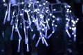 Blue icicle lights on the glass fence as a decoration for Christmas Royalty Free Stock Photo