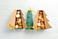 New Year and Christmas sweets. Cookies in the form of walnuts in Christmas tree-shaped boxes.