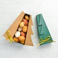 New Year and Christmas sweets. Cookies in the form of walnuts in Christmas tree-shaped boxes. Royalty Free Stock Photo