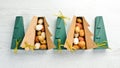 New Year and Christmas sweets. Cookies in the form of walnuts in Christmas tree-shaped boxes. Royalty Free Stock Photo