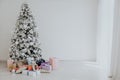 New year Christmas tree holiday gifts white interior winter decor Royalty Free Stock Photo