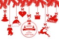 New Year Christmas. Various ornaments hanging on spruce branches, a Santa hat, a reindeer, a heart, a gift, a dog and a