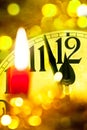 New year clock with flaming candle Royalty Free Stock Photo